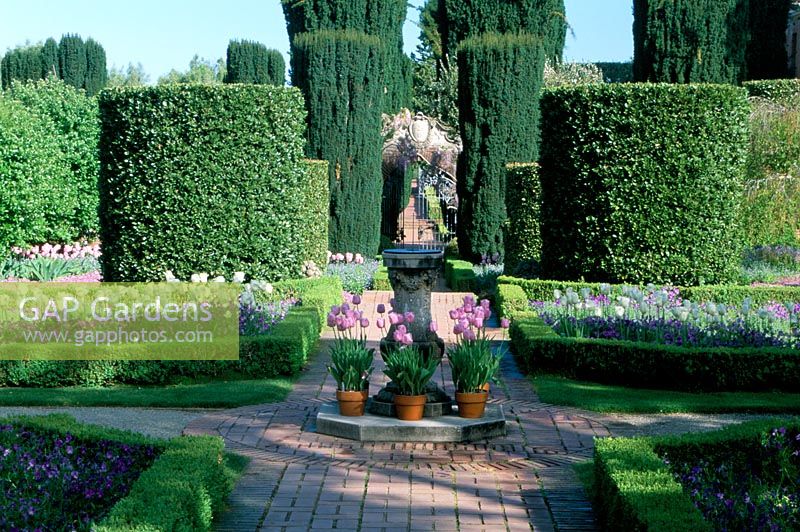 Spring garden with cross paths and sundial. Filoli gardens in California. US 
