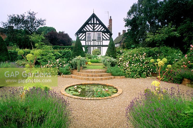Circular pond in formal garden at Wollerton Old Hall in Shropshire