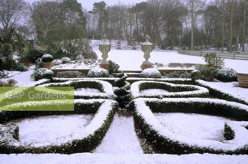 Winter garden with Buxus parterre covered in snow at Kettle Hill