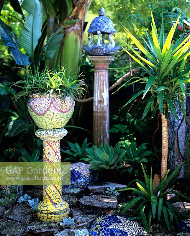 Mosaic pots on stands planted succulents
