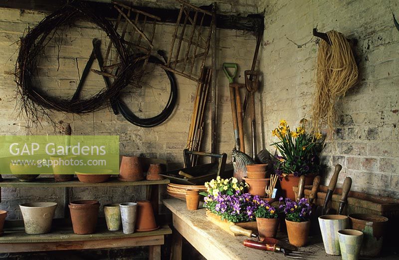 Potting shed with tools and pots at Thursley Lodge, Surrey