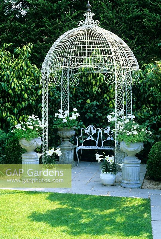 Decorative metal gazebo with containers at The Little Cottage, Lymington