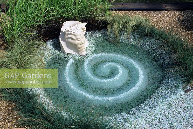 Recycled glass chip spiral in shallow pool. Still Water and Dreams.  