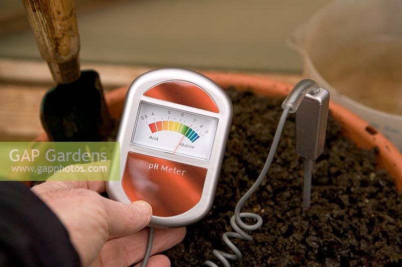 Hand-held pH meter in use