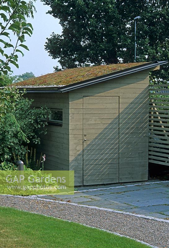 Wooden shed in corner of garden - Stocksund, Sweden
