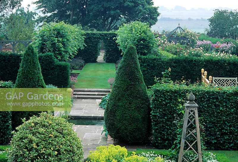 Overview of formal garden divided by Taxus hedges - Wollerton Old Hall, Shropshire.