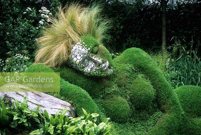The 4head Garden of Dreams - RHS Chelsea Flower Show 2006 - Living grass sculpture of reclining woman with mirror tiles on half of face and Stipa tenuissima as hair
