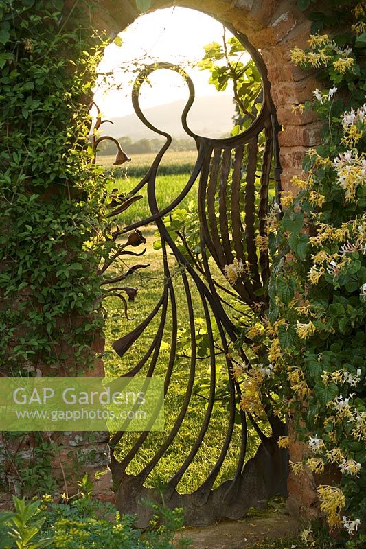 The angel gate in the walled garden looking over the Malvern Hills. Gate made by Mike Roberts