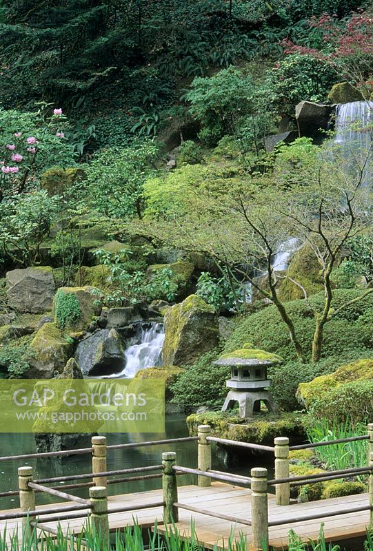 Japanese garden with pond and waterfall. Path deviates to confuse evil spirits - Japanese Garden, Portland, Oregon, USA