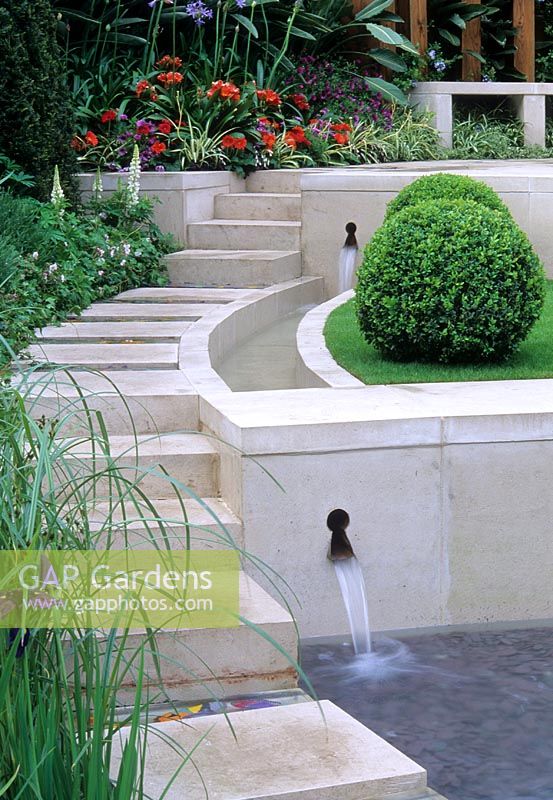 Contemporary style water feature with steps, water rill with cascades through retaining walls. Freedom to Future Garden - RHS Chelsea 2004