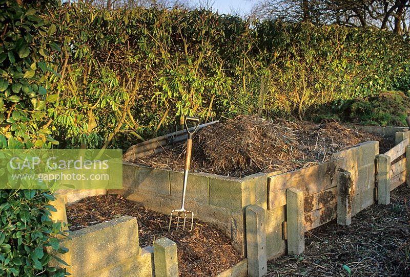 Compost bins constucted from breeze blocks and wooden shuttering at Old Rectory, Sudborough, Northants 