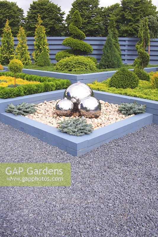 Water feature with three mirrored balls in gravel - 'Conifers by Design', Hampton Court 2007 
