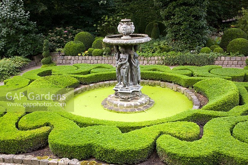 Baroque garden with formal parterre with pond