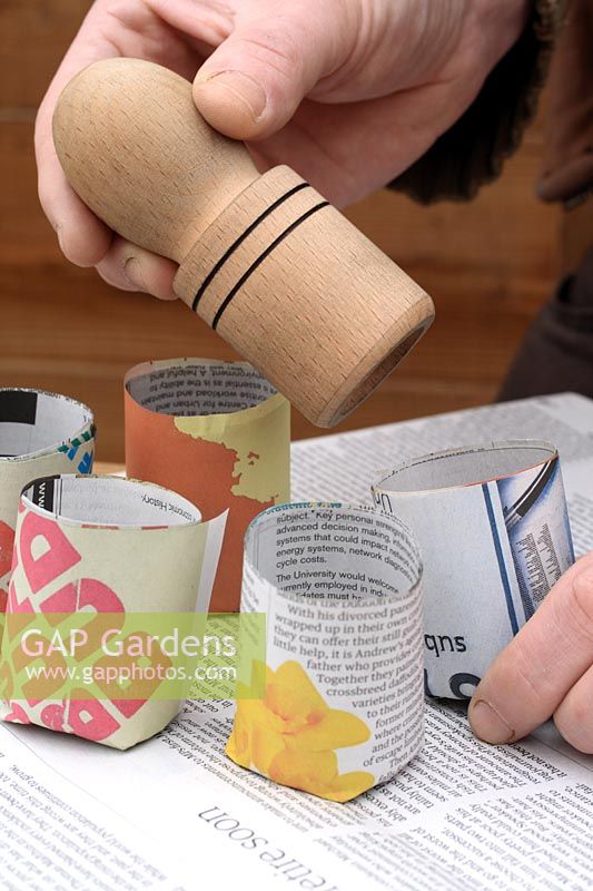Using a paper potter tool to make recycled and biodegradable newspaper pots