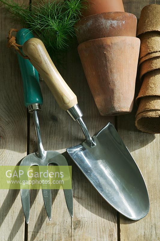 Hand fork and trowel with empty pots