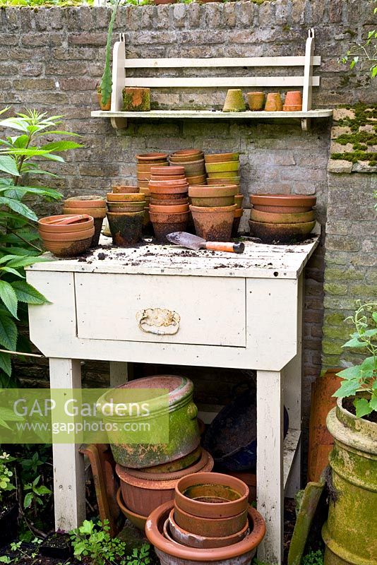 Rustic potting bench in walled garden