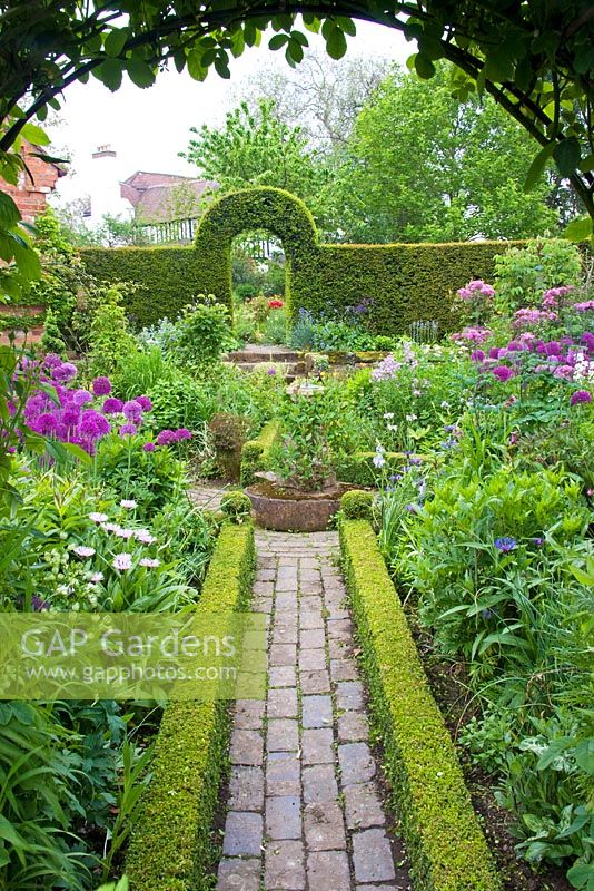 The Garden at Dial Park, Worcestershire -Planting includes box and yew hedges and Alliums