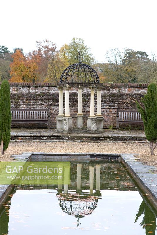 Arbour with reflection in pond in the Italian Garden at Arley Arboretum, Worcestershire, by kind permission of the Trustees of the R D Turner Charitable Trust
