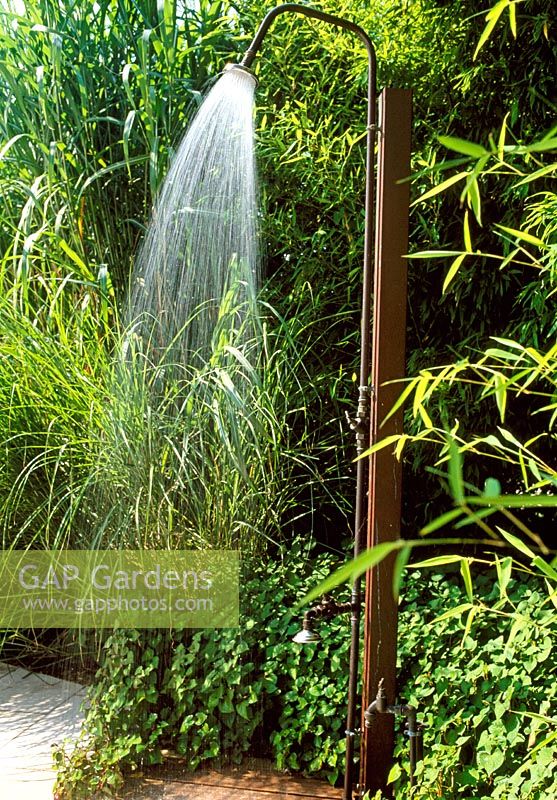 Outdoor shower with bamboo and grass planting