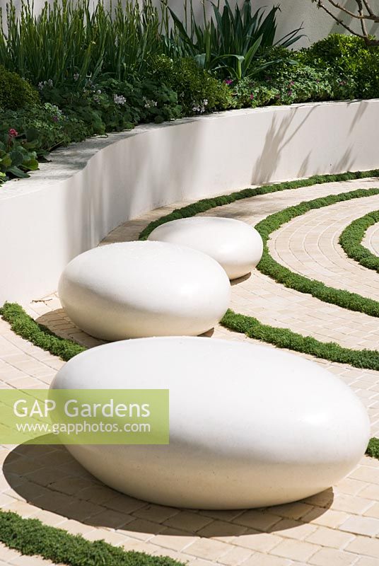 White pebble seats in The Cancer Research UK Garden, sponsored by Cancer Research - Silver-Gilt Flora medal winner at RHS Chelsea Flower Show 2009
