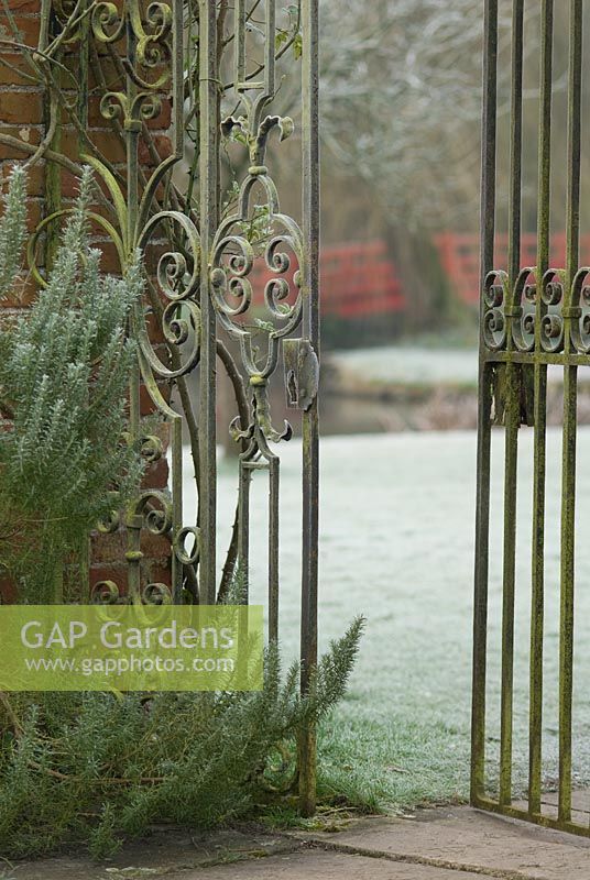 Detail of ornate metal gates in frost, Heale House Gardens, Wiltshire