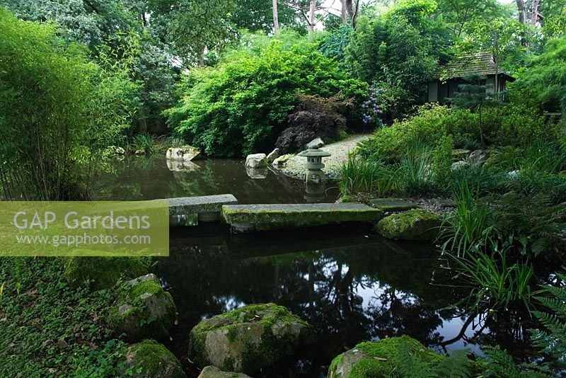 Pine Lodge Gardens - St Austell - Cornwall - The Japanese Garden - Showing the stone bridge across the lake
