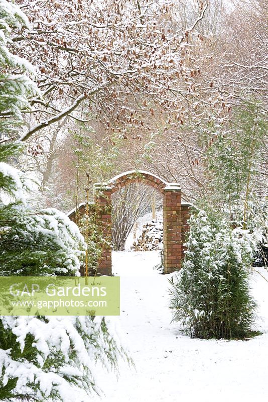 Brick archway in snow at Honeybrook House Cottage, Worcestershire