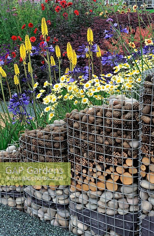 Gabion retaining wall for perennial planting on a slope - RHS Tatton Park Flower Show