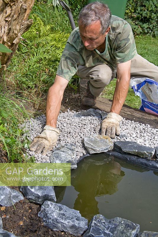 Garden pond project - step by step - adding gravel between liner and edging stones