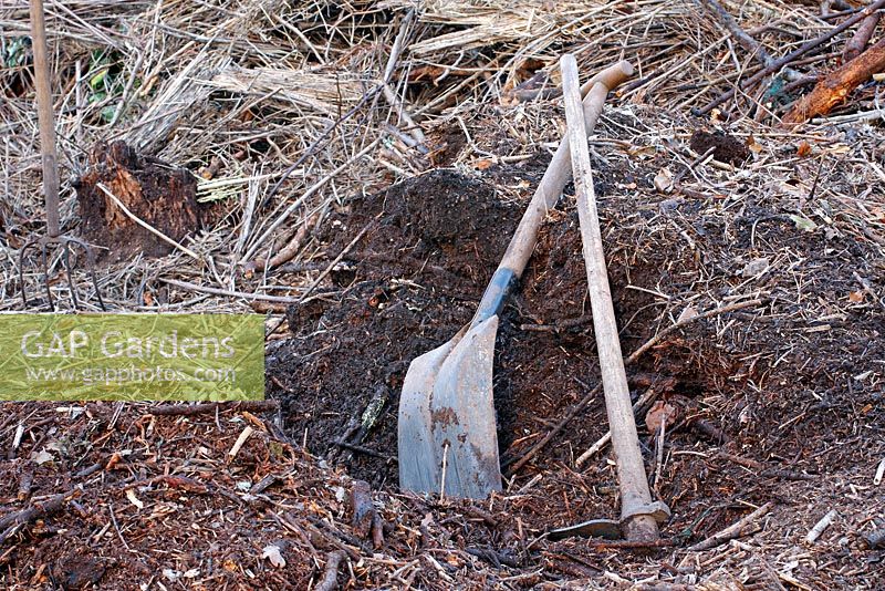 Woody garden material can be slowly composted in a swath and dug out after 3-10 years, having formed a friable soil improver or mulch for garden use