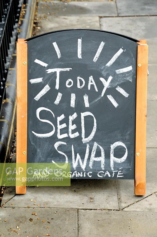 Bill board advestising a Seed Swap and Organic Cafe
