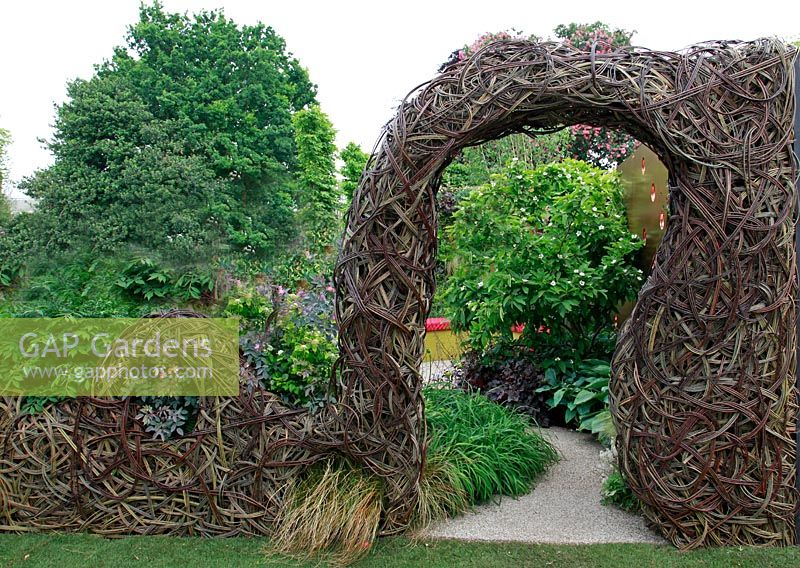 Willow woven archway and fence in the John Joseph Mechi Garden, sponsored by Wilkin and Sons - Bronze medal winner at RHS Chelsea Flower Show 2010