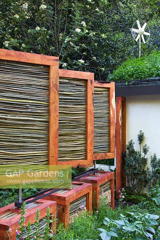 Wind protection screens that can be rotated by power generated by a wind turbine and assembled above insect havens. The SAC Strutt and Parker Sustainable Highland Garden, Silver Medal Winner, RHS Chelsea Flower Show 2010