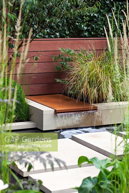 Pool with cascade and York stepping stones. 'Urban Serenity' - Gold Medal Winner - RHS Hampton Court Flower Show 2010 