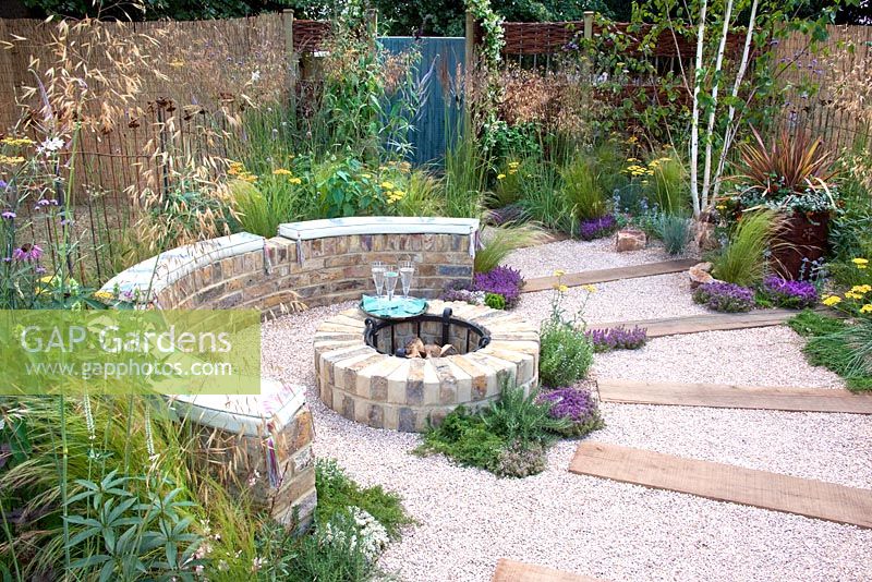 Brick built rustic fire pit, crushed recycled ceramic gravel path with sleepers - 'The Fire Pit Garden' - Silver Medal Winner at the RHS Hampton Court Flower Show 2010 

