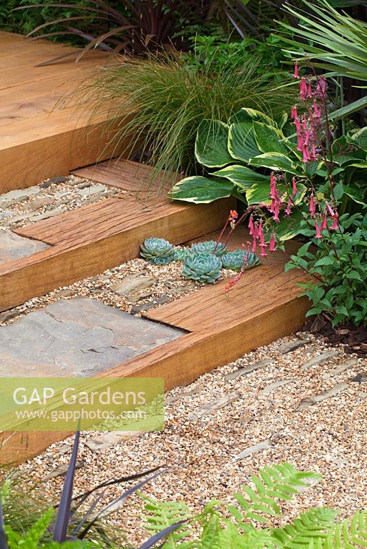 Gravel path and steps leading to oak deck. 'The Yoga Garden' - Bronze Medal Winner - RHS Hampton Court Flower Show 2010