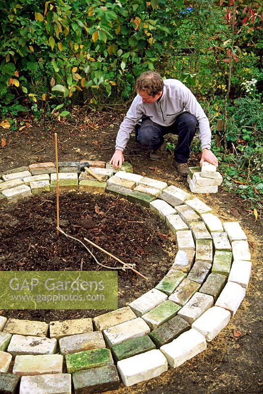 Mini potager - Step 4. Working from the inner circle place concentric rings of reclaimed bricks to form a circular path