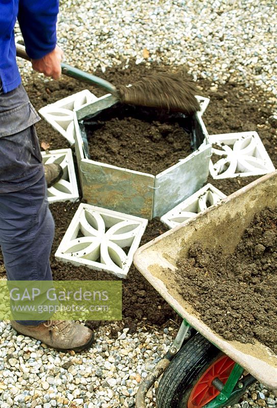 Herb Hexagon - Step 5. Line the sides of the raised bed with black polythene then fill with sandy or gritty soil