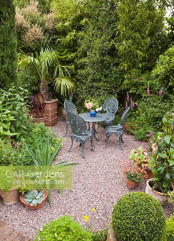 Seating area with containers in secluded suburban garden - High Trees, Longton, Stoke-on-Trent, Staffordshire, NGS
