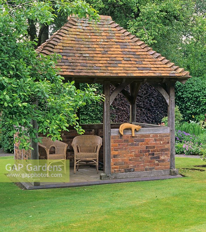 Oak, brick and tile built gazebo in Mrs Ann Lee's garden
