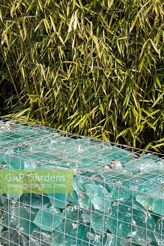Gabion with glass pieces, backed by bamboo - Appeltern garden, Holland 