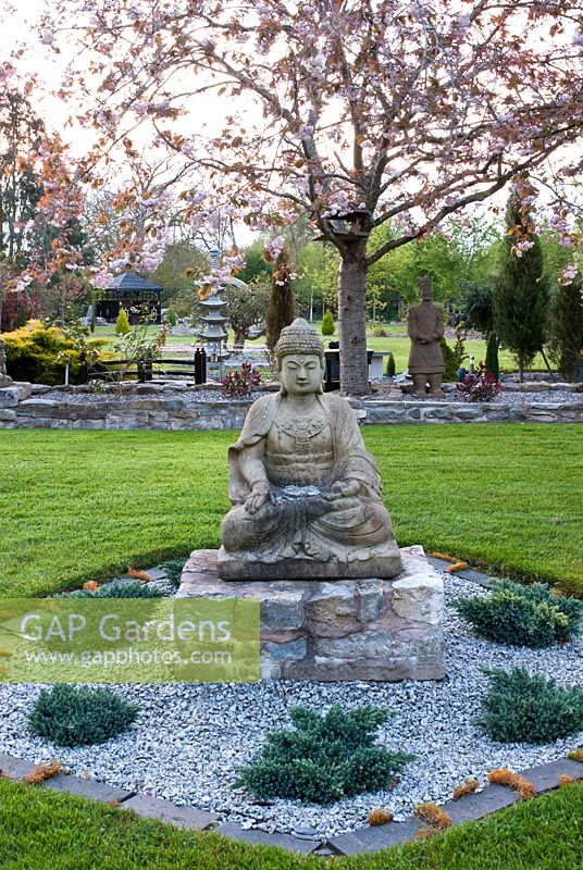 Buddha in newly planted Japanese garden