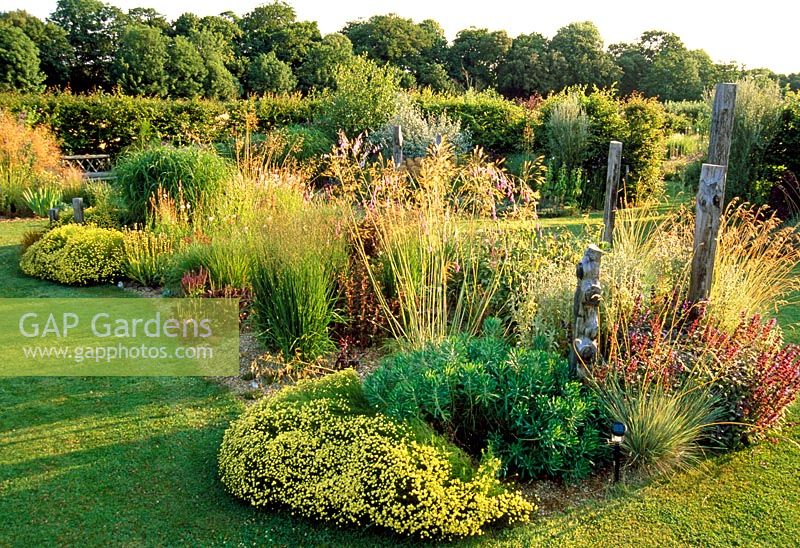 Late summer border of grasses and perennials