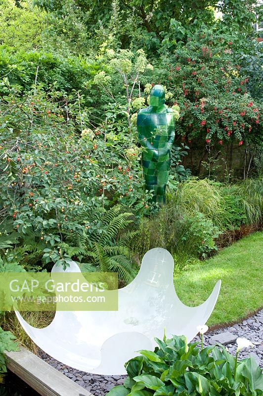 Resin sculpture and figure by Prunus - Cherry tree. Yulia Badian garden, London, UK