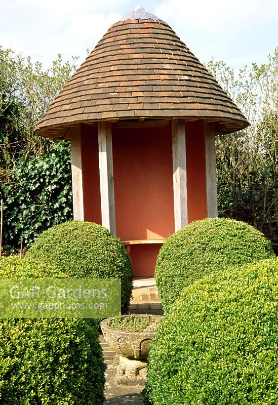 Round Summerhouse and clipped Buxus