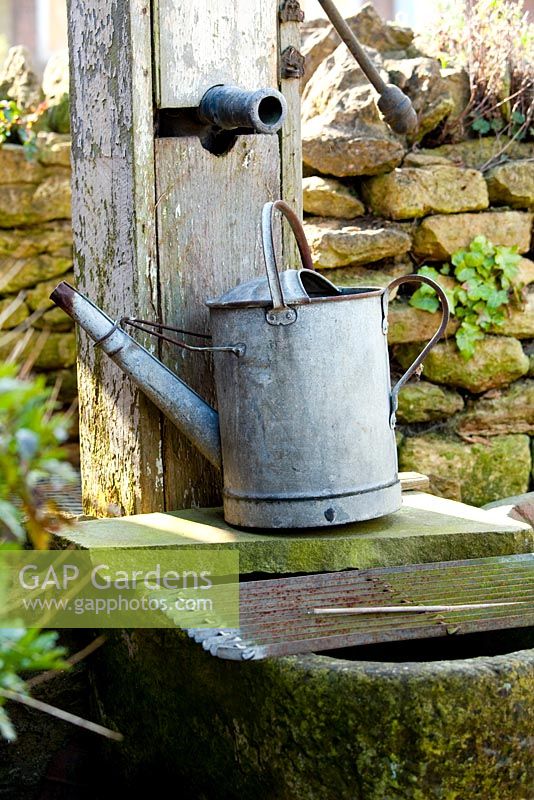 Galvanised watering can at pump - Chapel Street 
