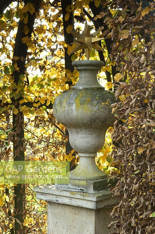 Stone urn on plinth - Silverstone Farm, Norfolk