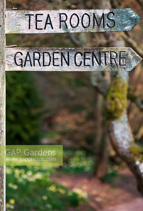 Old Wooden garden centre sign at Batsford Arboretum, Glouchestershire, England