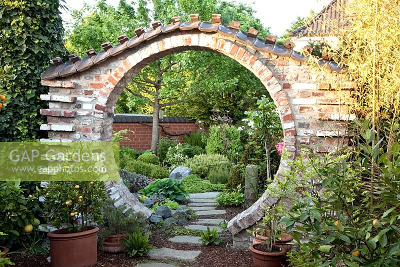 Circular entrance into Asian styled garden