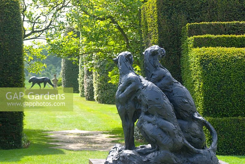 'Sitting Cheetahs' in the Predators and Prey ll exhibition -  The Dylan Lewis Bronzes collection - Arley Hall and Gardens, Cheshire